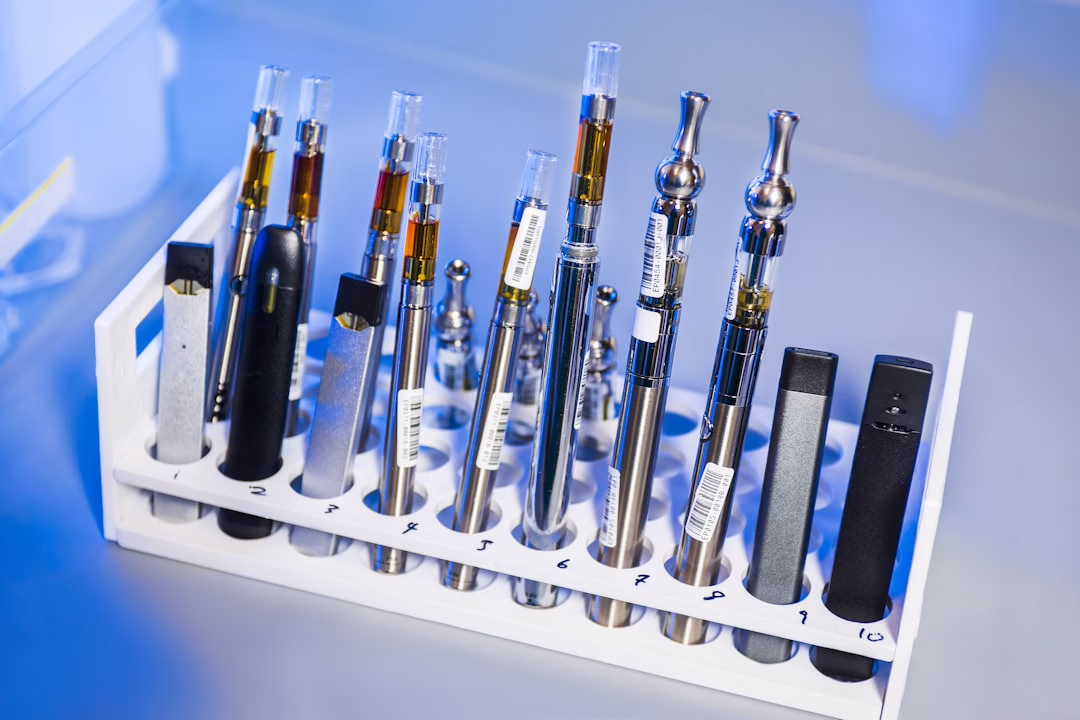Various vape pens and cartridges in laboratory holder