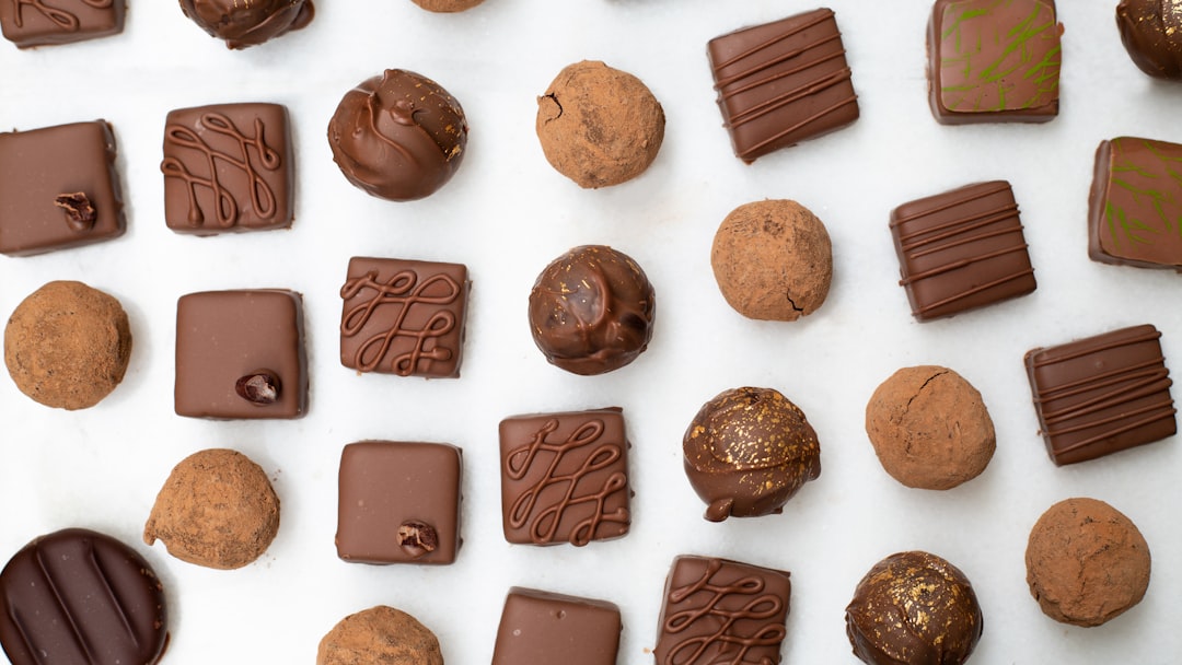 Assorted gourmet chocolate truffles and pralines arranged