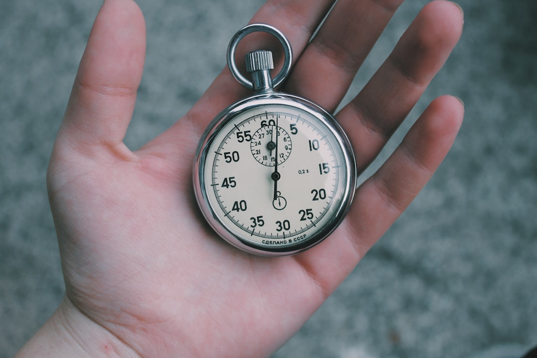 Hand holding vintage stopwatch timer