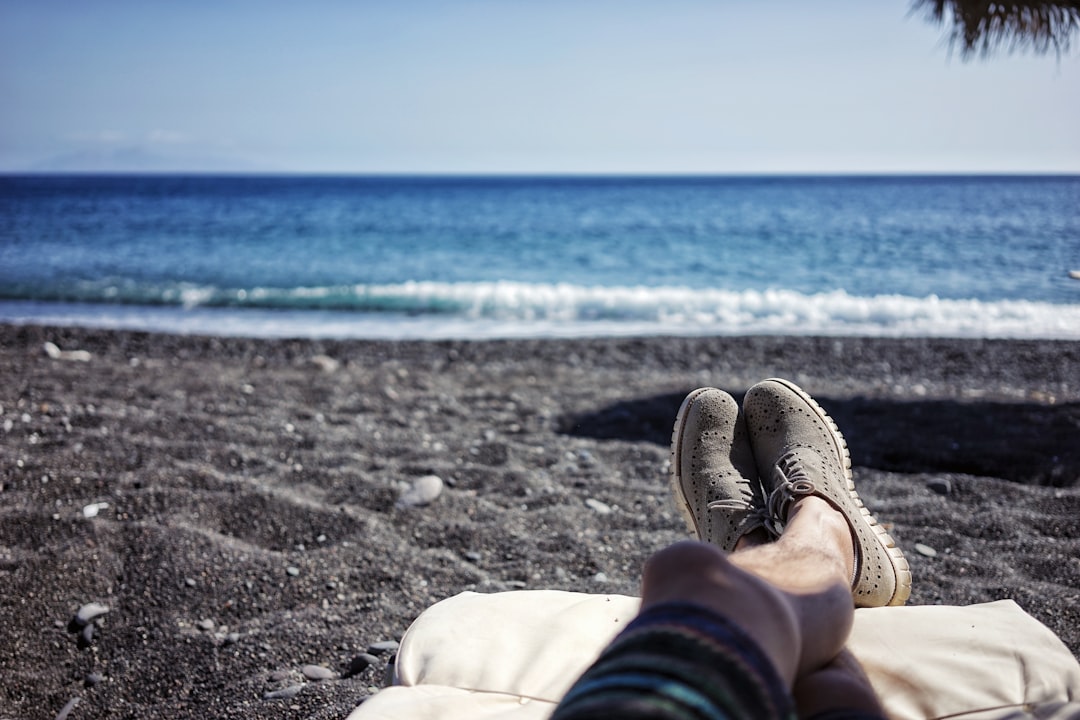 Relaxing on black sand beach ocean view